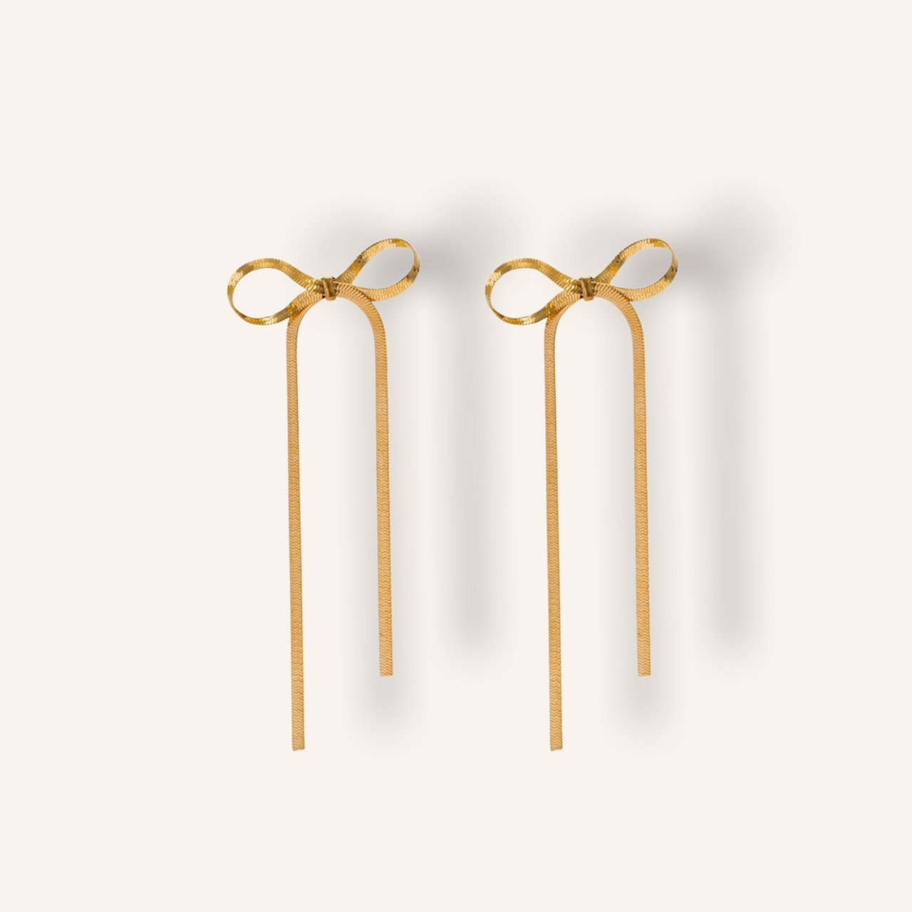Long bow gold earrings 💧