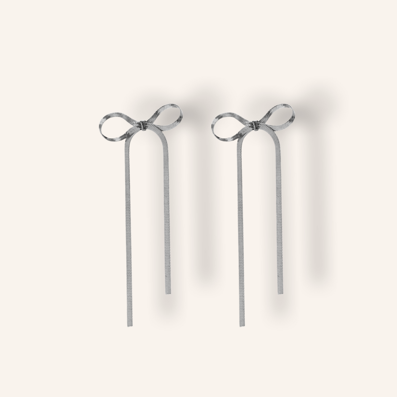 Long bow silver earrings 💧